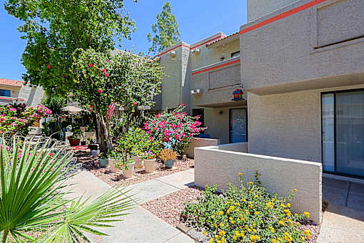 A concrete building with a red stripe on the side.