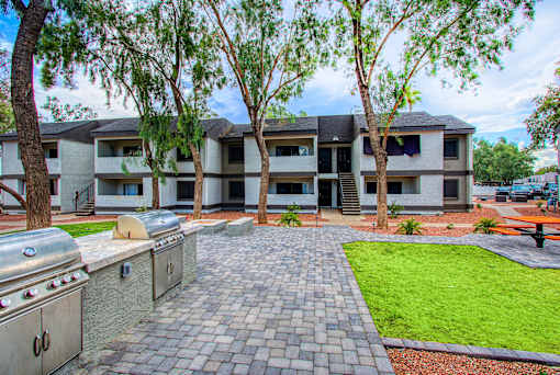 A building with a brick walkway in front of it.