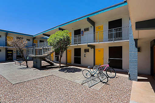 Bicycle parked on a gravel at The Link Apartments, Mesa, AZ, 85201