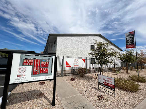 A sign for a fire station is displayed in front of a building.