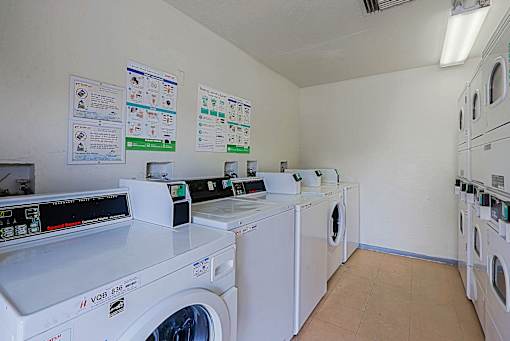 Laundry Room with row machines at Sahuaro West Apartments, Phoenix, 85029