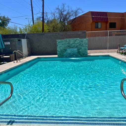 a swimming pool at a hotel with a resort style pool