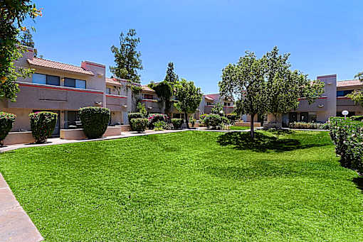A grassy area in front of a building.