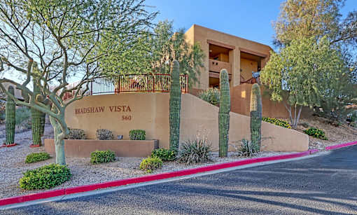 A desert-themed building with a sign that reads Bradshaw Vista 560.