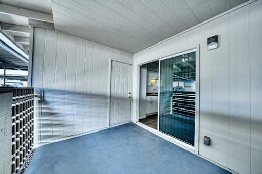 Room with glass door at Connect on University, Mesa