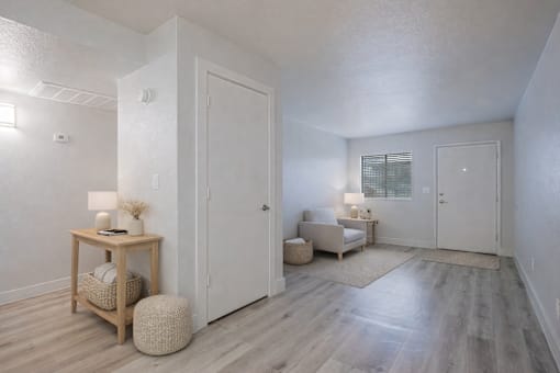 A room with a wooden floor and white walls.