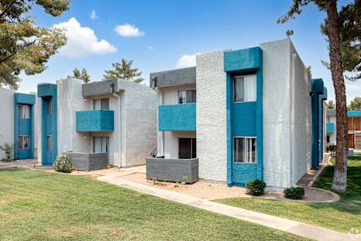 A row of modern style houses with blue trim.