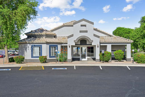 The Barton Apartments front of a building with a parking lot