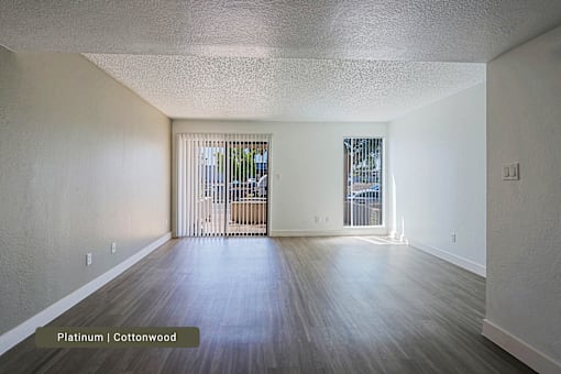 A room with platinum colored flooring and cottonwood colored walls.