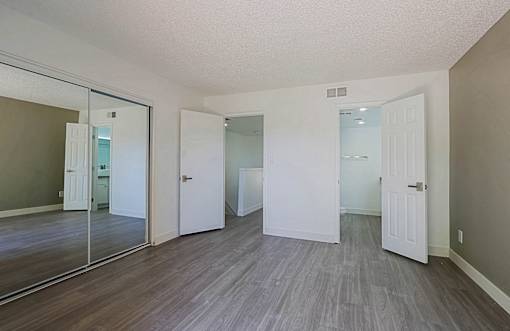 A room with a grey floor and white walls.