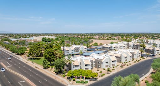 an aerial view of a neighborhood with houses and a highway