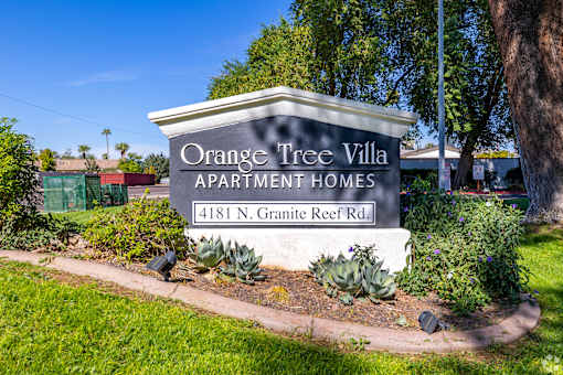 the sign for Orange Tree Villa apartments