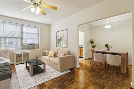 A living room with a brown coffee table and a beige couch.