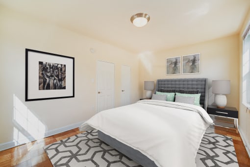 bedroom with bed, windows and hardwood floors 1401 sheridan apartments in washington dc