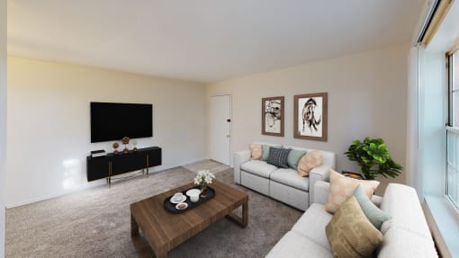 living area with sofa, coffee table, credenza, tv and view of front entrance at manor village  tax credit apartments in washington dc