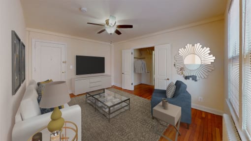 living area with sofa, coffee table, credenza, tv, and hardwood floors at 2801 Pennsylvania apartments in washington dc