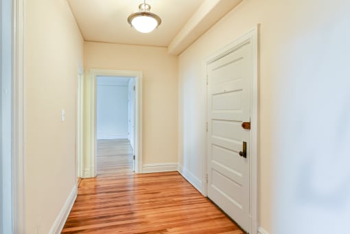 foyer of apartment with modern lighting and hardwood flooring at  2701 Connecticut apartments in washington dc