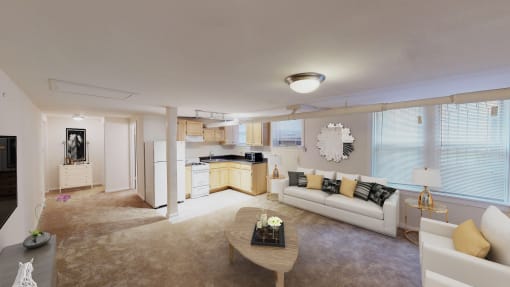 living area with large windows, sofa, coffee table, hardwood floors and view of kitchen at 1818 riggs apartments in washington dc
