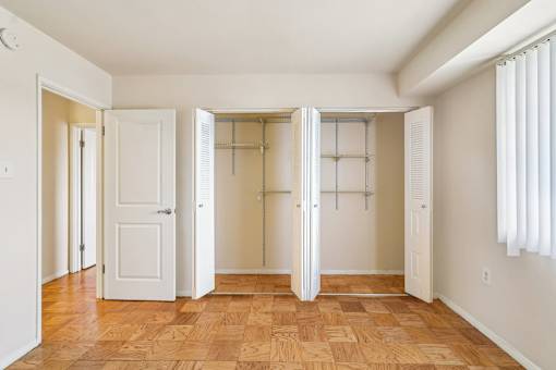A room with a wooden floor and white walls.