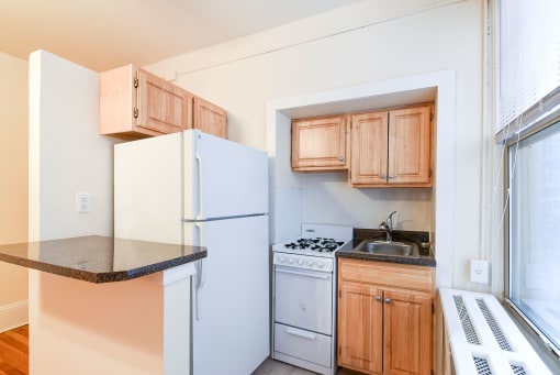 kitchen with large windows and energy efficient appliances at the cortland apartments in washington dc