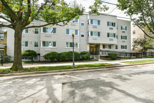 exterior of stone apartment building at 734 longfellow street apartments in washington dc