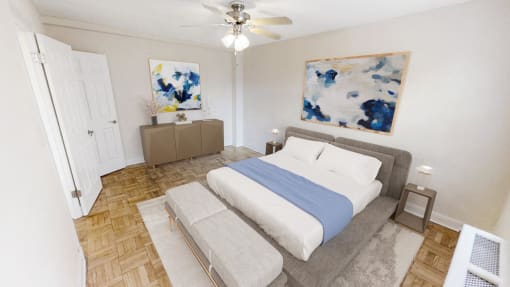 a bedroom with a bed and a ceiling fan