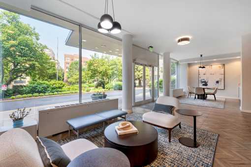 A modern living room with a view of the street outside.