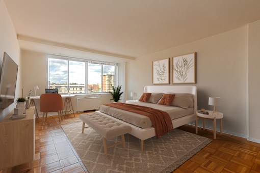 A modern bedroom with a large bed and a television.