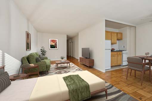A living room with a couch, chair, and television.