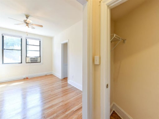 large closet with view of living area at the klingle apartments in washignton dc