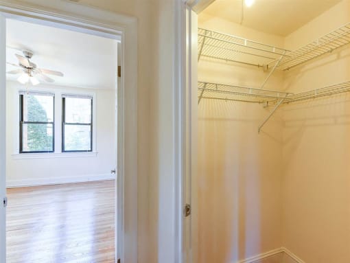 large closet with view of living area at the klingle apartments in washignton dc