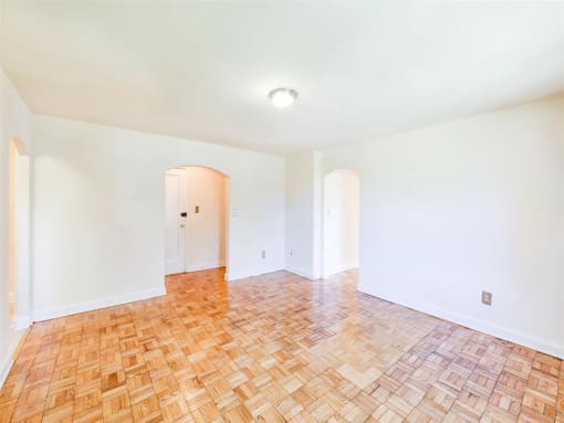 vacant living area with hardwood floors at randle circle apartments in washington dc