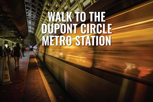 A subway station with a sign that says "Walk to the Dupont Circle Metro Station".