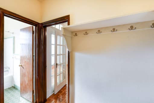 view of bathroom and custom shelving in hallway of eddystone apartments in washington dc