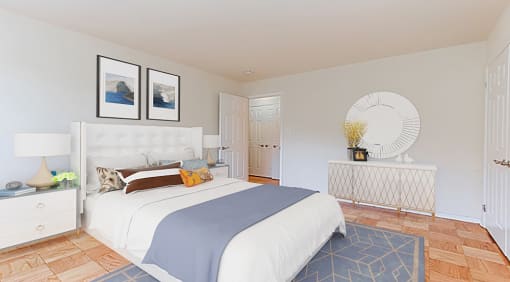 bedroom with bed, nightstands, dresser, mirror and hardwood flooring at fort totten apartments in washington dc