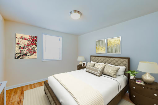 bedroom with bed, night stand, hardwood floor and modern lighting at garden village apartments in congress heights washington dc
