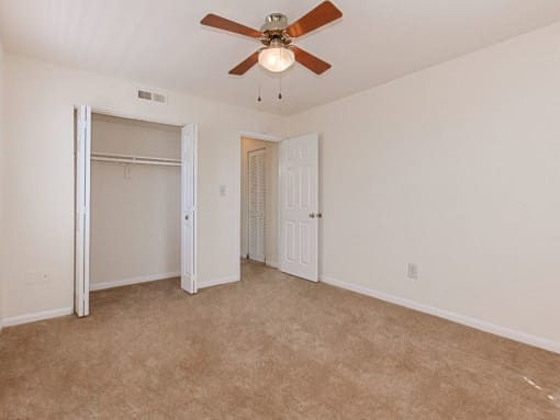 bedroom with carpeting and ceiling fan at grandview village apartments in shipley terrace washington dc