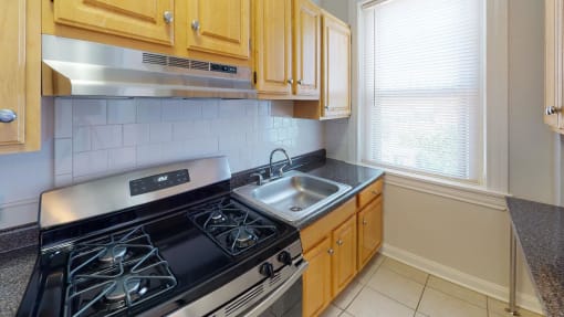 kitchen at hampton courts apartments in dc with stainless steel appliances