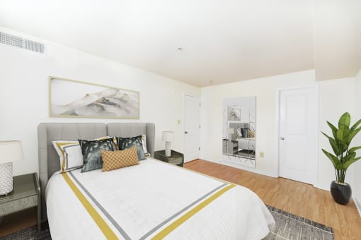 bedroom with bed, nightstand, and closet at jasper place apartments in washington dc
