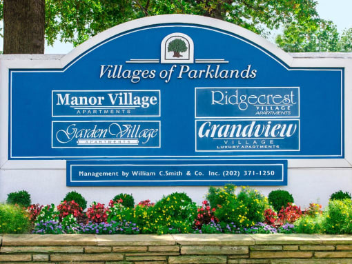 Villages of parklands monument sign next to manor village apartments in washington dc