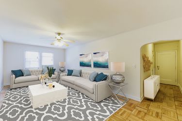 living area with sofa, coffee table, ceiling fan and view of foyer at  meridian park apartments in washington dc
