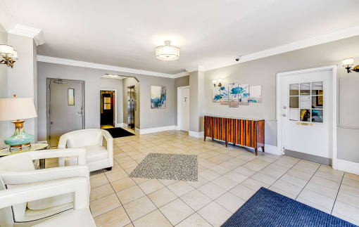 lobby lounge with social seating and modern artwork at the meridian park apartments in columbia heights washington dc