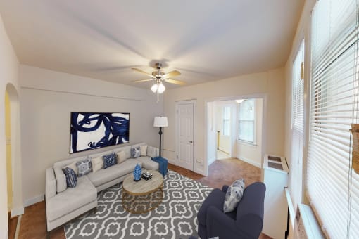 living area with large windows, sofa, coffee table, hardwood floors, and ceiling fan at parkside apartments in washington dc