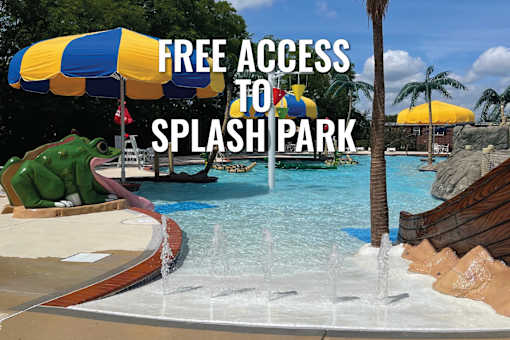 A splash park with a sign that says "FREE ACCESS TO THE SPLASH PARK".