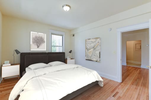 Bedroom with bed, nightstands, and large closet  at twin oaks apartments columbia heights washington dc