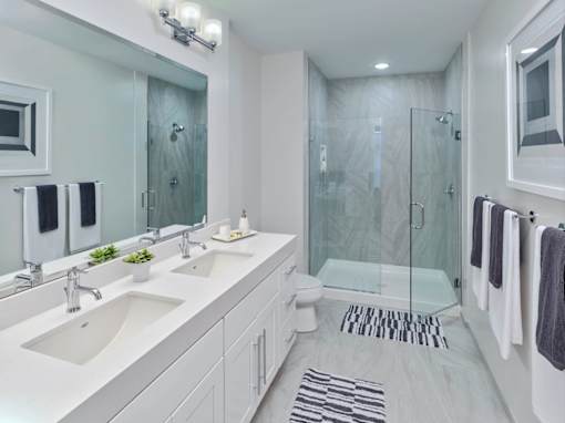 Bathroom with twin sinks in a two bedroom apartment in Owings Mills