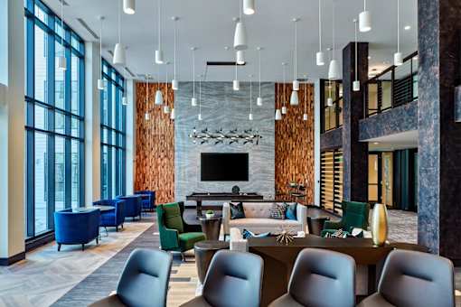 Grand Clubroom with lots of seating, TV, and pool access