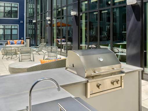 Grill area or BBQ area in a courtyard with a seating area