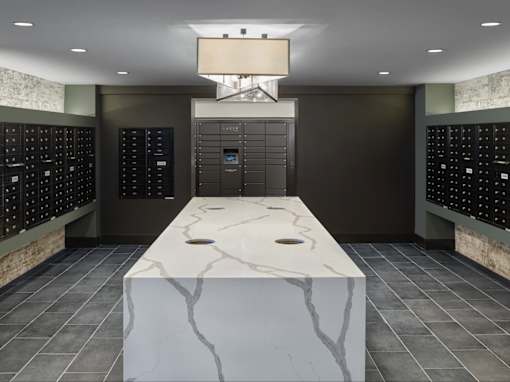 Mail room with Package receiving. Luxer One lockers in luxury apartment building.