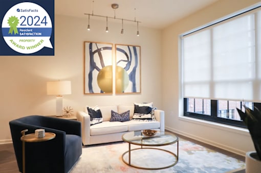 The Met Living Room Interior Image with Resident Satisfaction Award Logo Badge